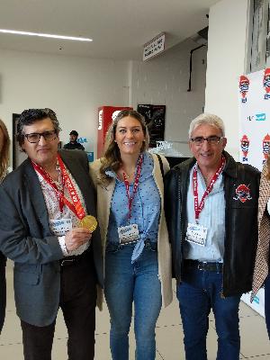 Tony Katz and I with Natalie Spooner, holding Olympic Gold Medals
